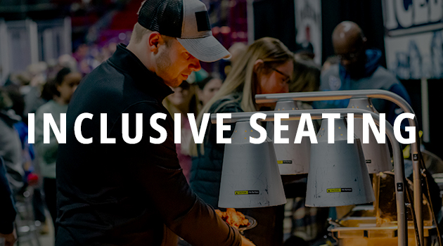 Guests in our Inclusive Seating area at the food bar with a link to our Inclusive Seating page.
